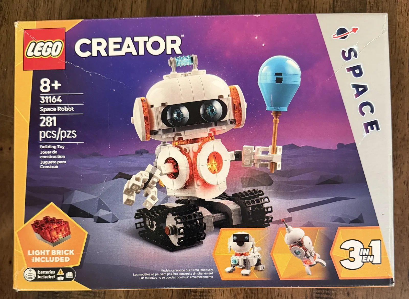 LEGO 31164 Creator 3-in-1 Space Robot — retail box front showing the robot with a balloon and the 3-in-1 build options