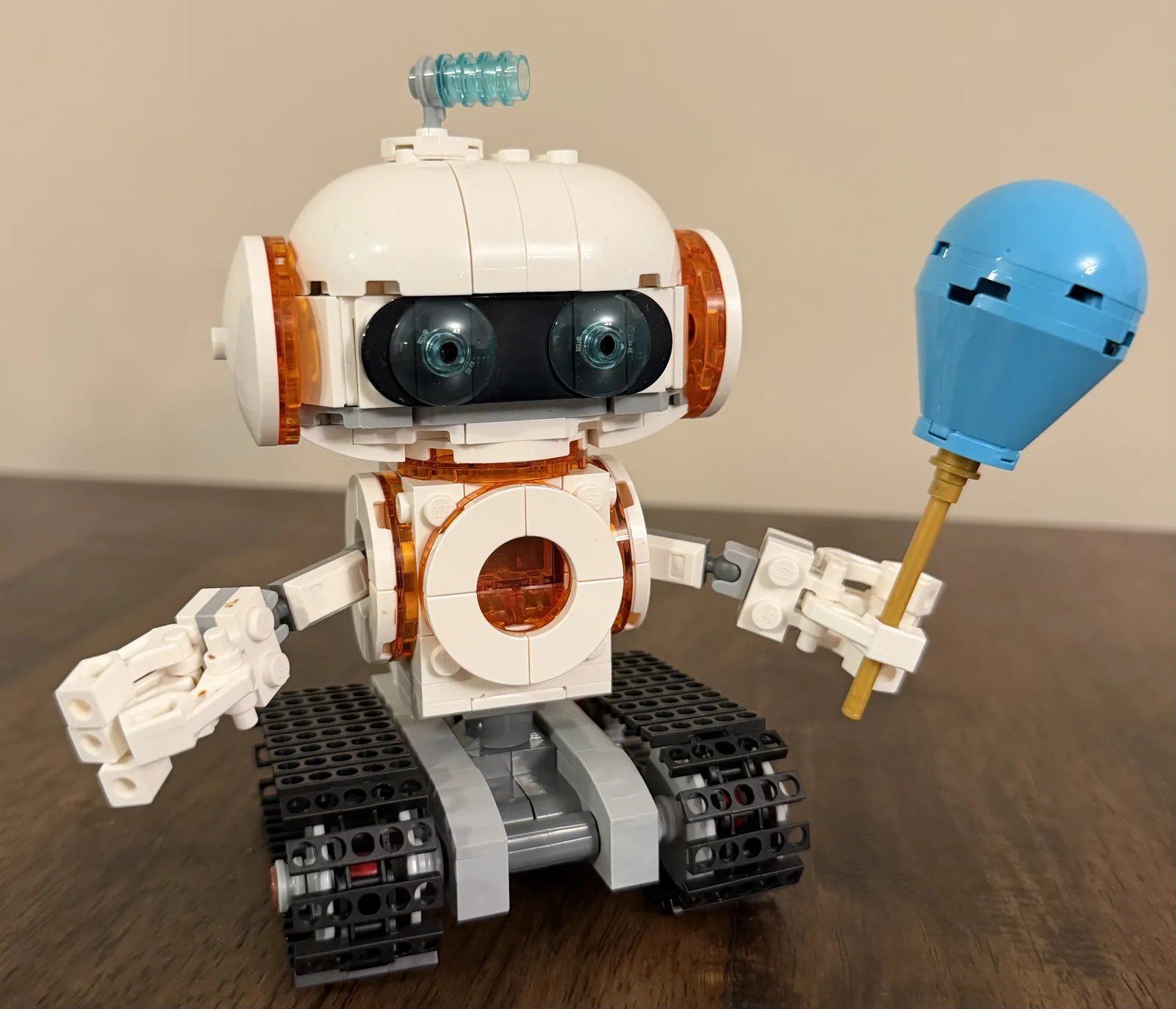 LEGO 31164 Creator 3-in-1 Space Robot — finished robot build holding a blue balloon on tank treads