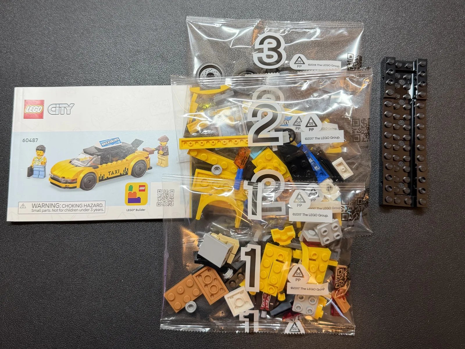 LEGO 60487 Yellow Taxi — opened box with bags and instructions