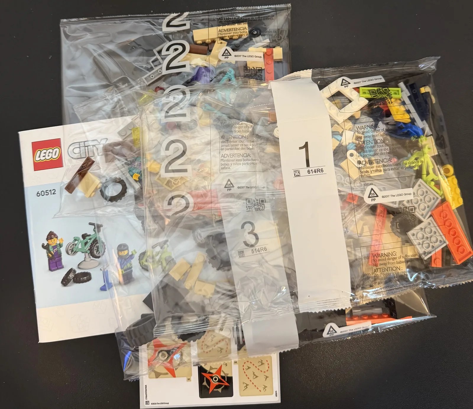 LEGO City 60512 Mountain Bike Adventure Van — bags, instructions and sticker sheet after unboxing