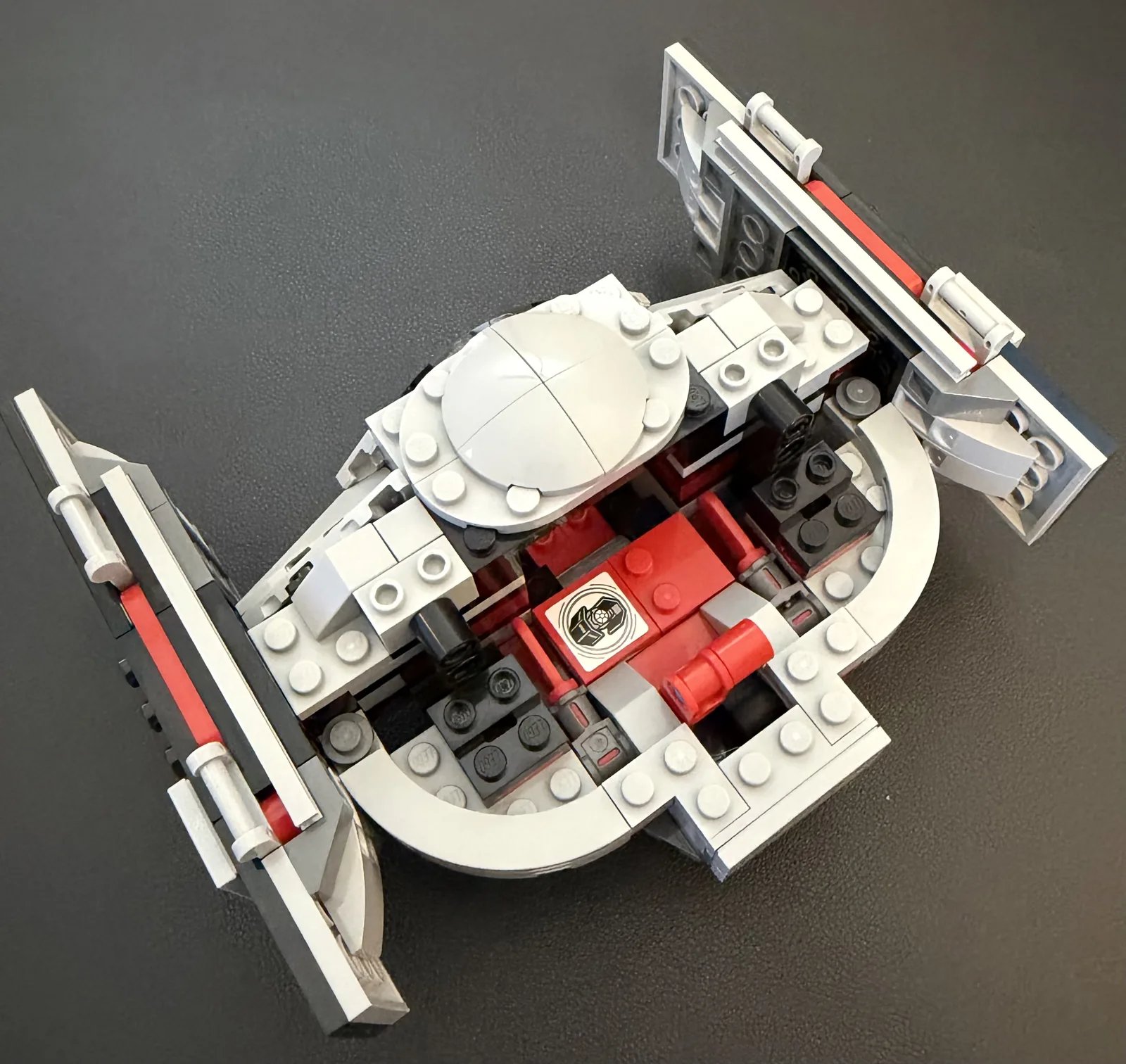 LEGO 75421 Darth Vader's TIE Fighter — build step 9, wings attached to the hull