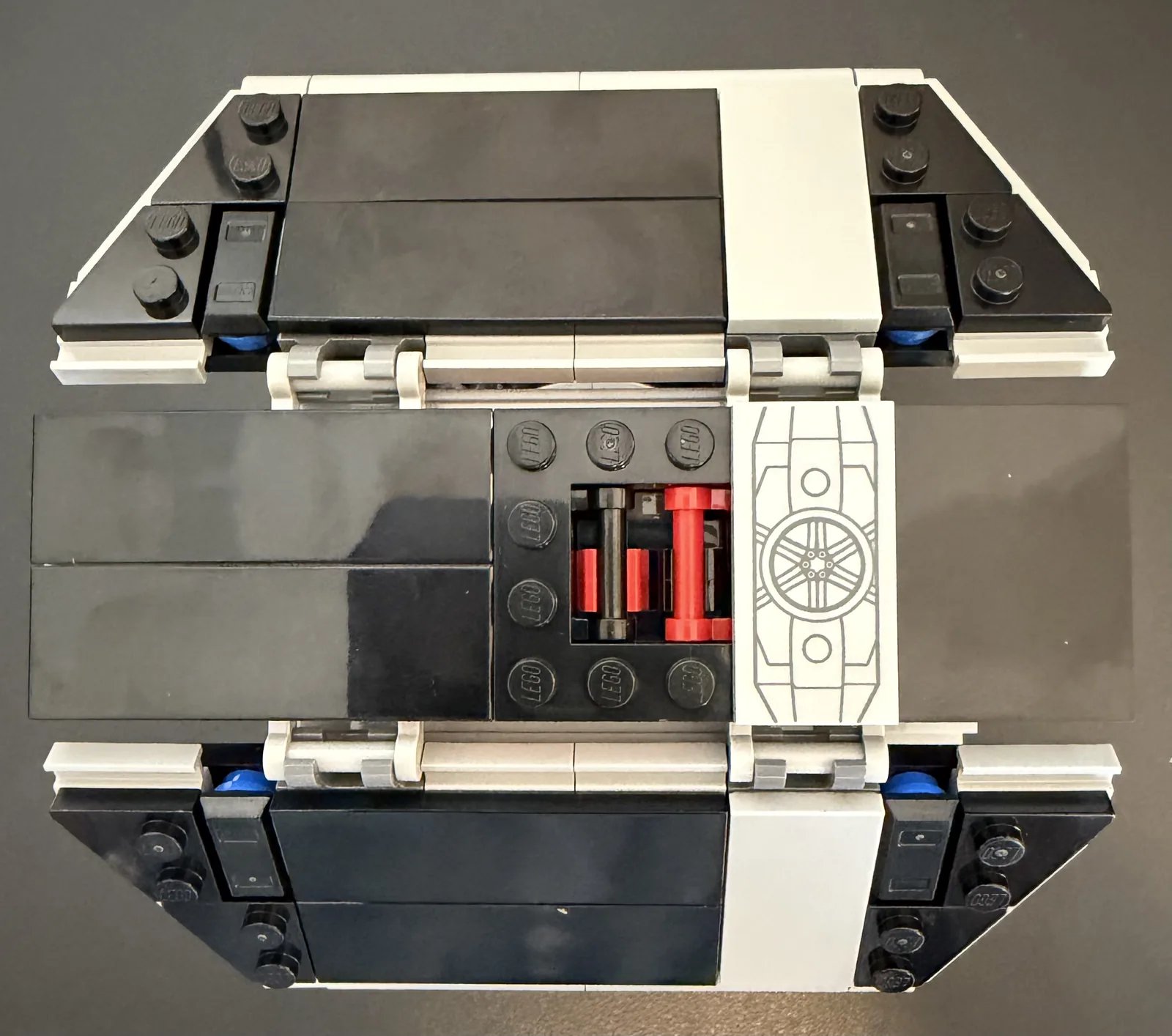 LEGO 75421 Darth Vader's TIE Fighter — wing panels laid flat, showing the hinge clips and printed hull tile