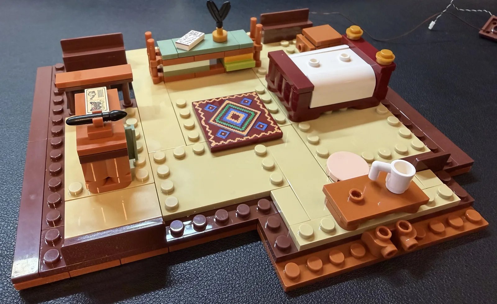 Lumibricks 10010 Waterfall Cabin — second-floor bedroom and study under construction