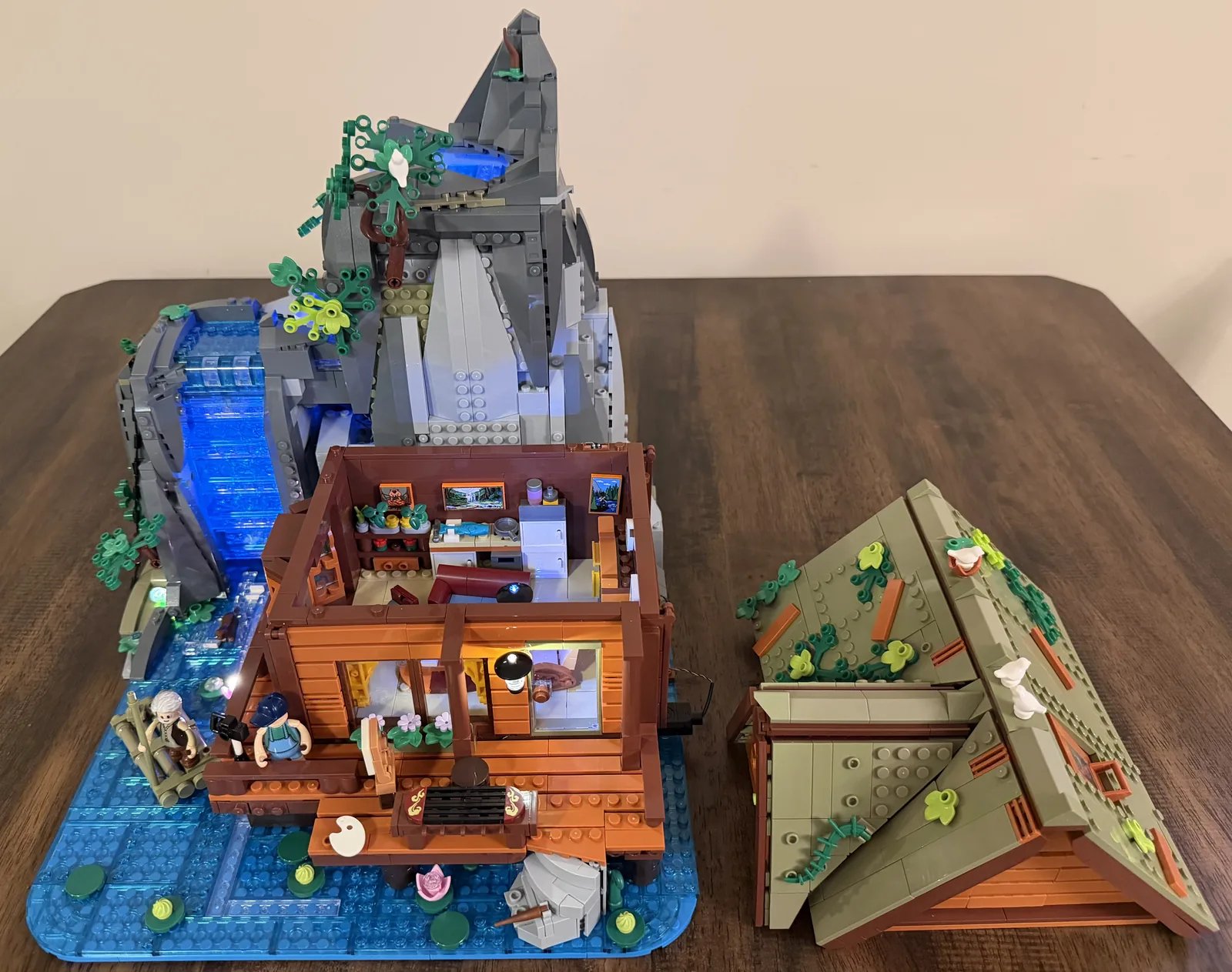 Lumibricks 10010 Waterfall Cabin — finished cabin with roof removed to show the lit interior