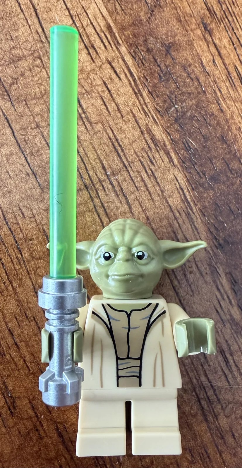 LEGO 75438 Star Wars Yoda Bust — the included Yoda minifigure with lightsaber