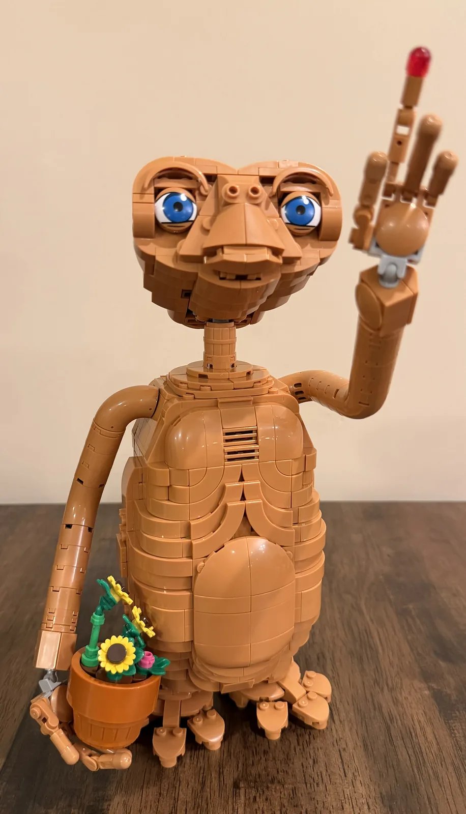 LEGO Ideas 21370 E.T. the Extra-Terrestrial — finished build holding the pot of sunflowers
